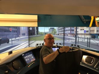 Picture of D. Rittel is driving a virtual tram at Universite  Polytechnique Hauts de France